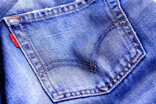Fragment of blue modern jeans with pocket, can be used as a background. 
