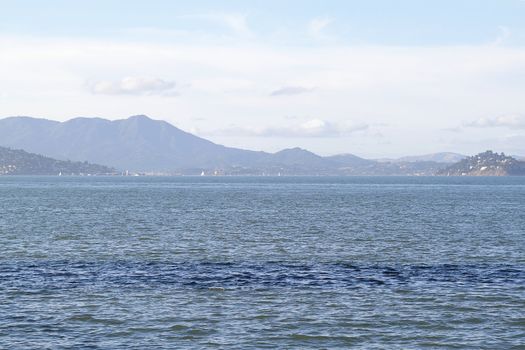 Seascape in San Francisco bay with mountains on background
