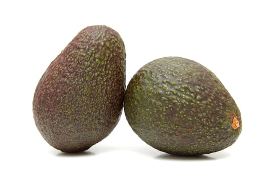 Two avocados isolated on the white background