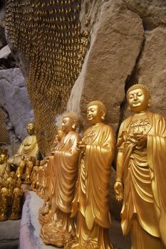 Golden statues of Buddha in carving in Ipoh, Malaysia, Asia.