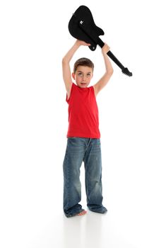 A young boy rockstar holding a guitar over his head.  White background.