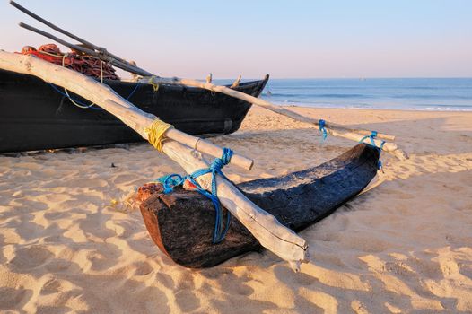 The old fishing boat on the sandy shore