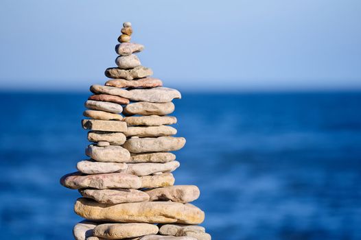 Stout pile of cobblestone on the sea shore