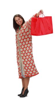 Happy young woman with a red shopping bag isolated against a white background.