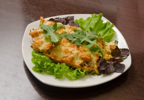 chicken fillet baked with zucchini, rucola lettuce
