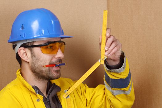 Worker measured with folding ruler