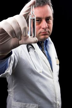 medic holding ampule with vaccine