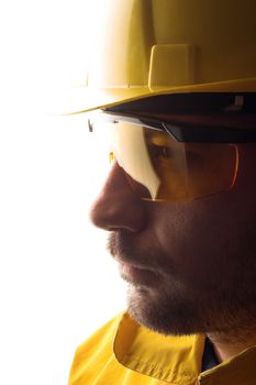  worker with yellow helmet over white
