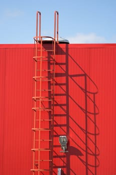 industrial facade -a red metal fire-escape