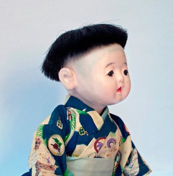 portrait of a japanese little boy. doll of collection of the years 1950/60.  
representation of past and nostalgia