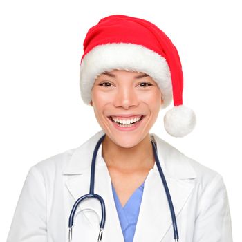 hristmas doctor. Medical professional woman wearing red santa hat smiling at camera. Young Asian Caucasian woman isolated on white background.