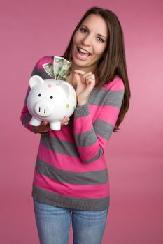 Woman holding piggy bank money