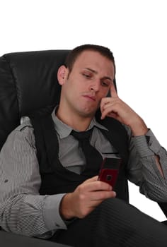 Young man checking his mobile phone, isolated against a white background.