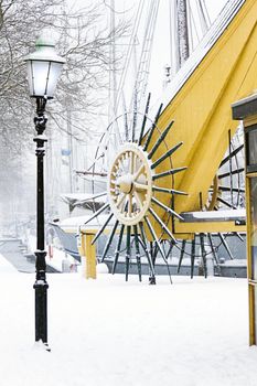 Snow in the city - old wintery harbor - it is snowing