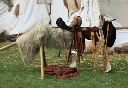 Various types of bigpipes on a stand in front of a tent during a medieval festival in Nogent le Rotrou,France.