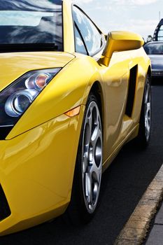 Saide view of a yellow sports car
