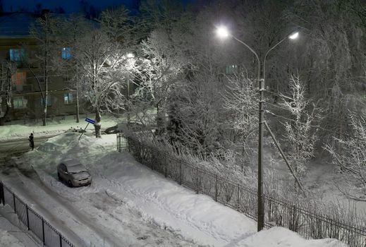 peaceful snowy winter evening on a small town street