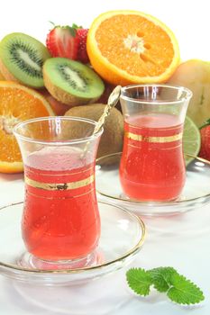 Fruit iced tea with fresh fruit and ice cubes