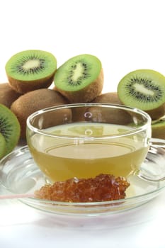 Kiwi tea with fresh kiwi on white background