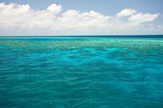 Ocean blue water with reef in the distance. 