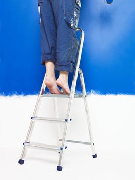Painting Girl on a step ladder