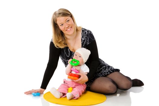 Mother playing with baby sitting on floor isolated