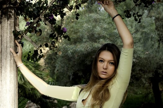 View of a beautiful blond woman posing on a fashionable way.