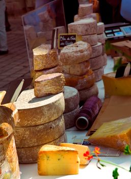Assorted cheeses for sale on french farmers market in Perigueux, France