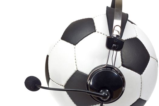 soccer concept, classic ball in headphones, as commentator isolated on white