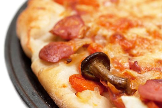 Hot fresh pizza with mushrooms on a baking tray