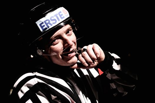 ZELL AM SEE, AUSTRIA - FEB 1: Austrian National League. Referee Roland Altersberger during light out break. Game EK Zell am See vs. ATSE Graz (Result 4-1) on February 1, 2011, at hockey rink of Zell am See