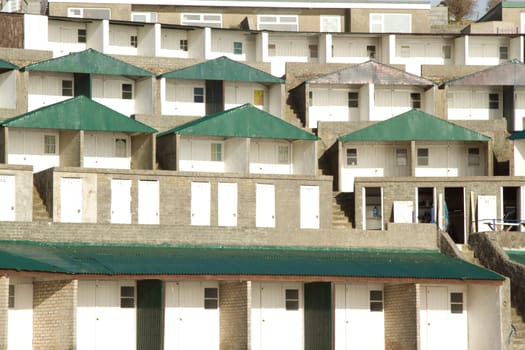 Municipal tiered, generic, beach huts made out of concrete with dividing steps