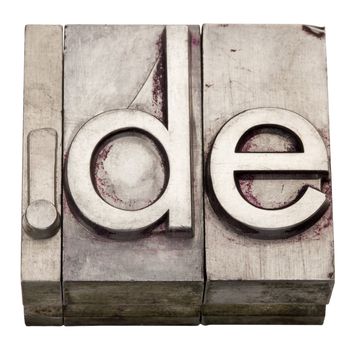 dot DE - internet country domain  for Germany,  grunge metal letterpress printing blocks, stained by ink, isolated on white