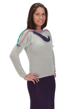 Young woman wearing knitwear clothes isolated against a white background.