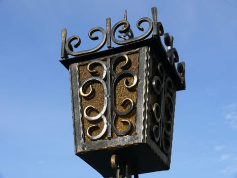 Old lantern in blue sky background