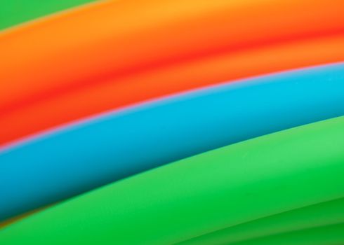 Macro of a stack of colorful plastic tubes