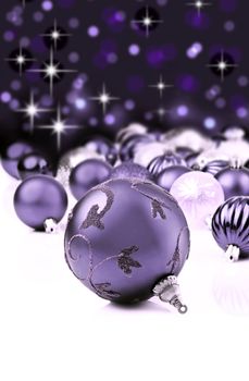 Purple decorative christmas ornaments with star background