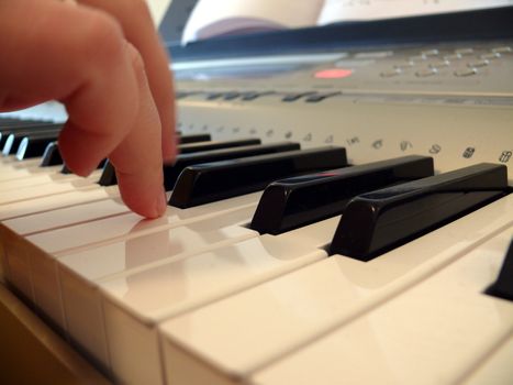 Hand with piano keyboard