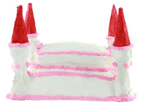 Birthday cake in the shape of a castle isolated on a white background.