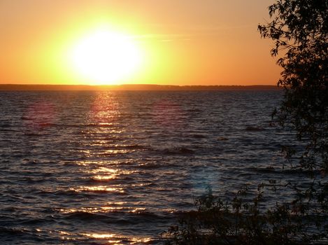 Golden romantic sunset in the lake