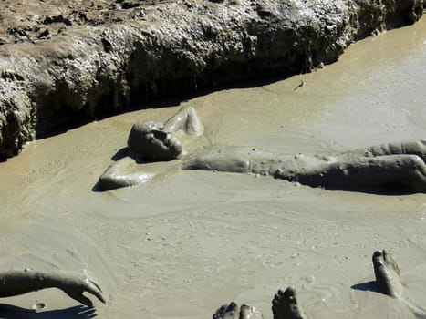 peoples relax in the clay puddle