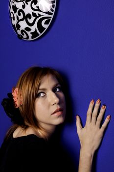 View of a beautiful woman hearing the wall.