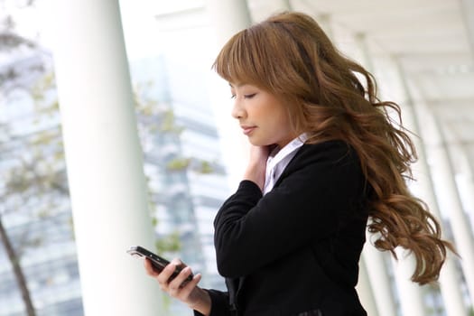 beautiful business woman on the phone at modern building 