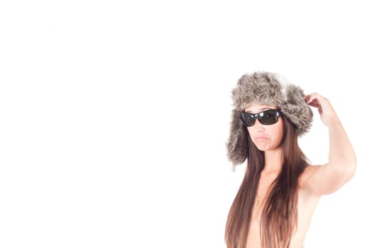 Studio shot of beautiful woman in fur hat