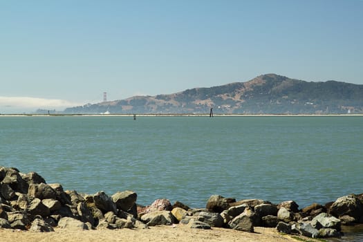 Seascape with mountain on background on sunny day