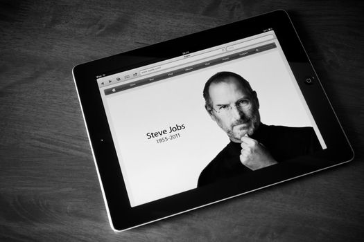 Kiev, Ukraine - October 06, 2011 - Steve Jobs, founder of Apple Computers, has died at the age of 56 years. Photo of the founder on the website apple.com shown on the Apple Ipad2 device. Processed in BW.
