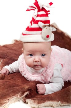 Shot of little cute baby in lying on fur