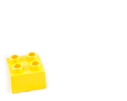 Plastic building blocks on white background. Bright colors.