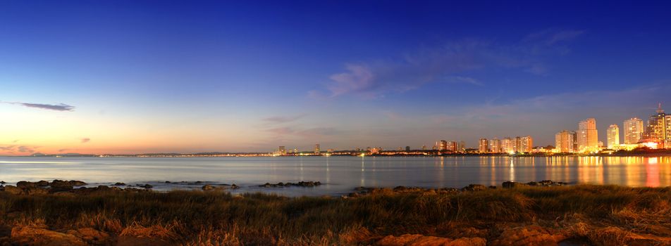 Panoramic golden sunset at Punta del Este seashore city. Uruguay.