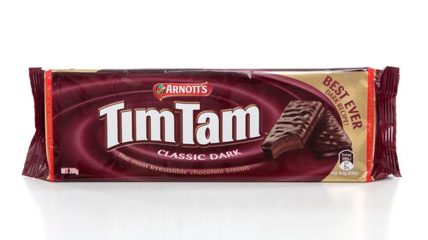 Packet of Tim Tams - biscuits made by Arnott's Biscuits, Australia. comprising two layers of chocolate malted biscuit,  a light chocolate cream filling, and coated in a thin layer of chocolate. Named by Ross Arnot after the winning horse at Kentucky Derby.  White background.
EDITORIAL USE ONLY
